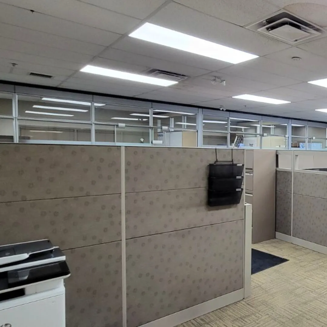 Commercial office fit-out with systems-furniture power and LED lighting
